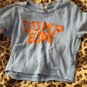 Garage Light Blue Crop Tee with Orange "DUMP HIM" Graphic
